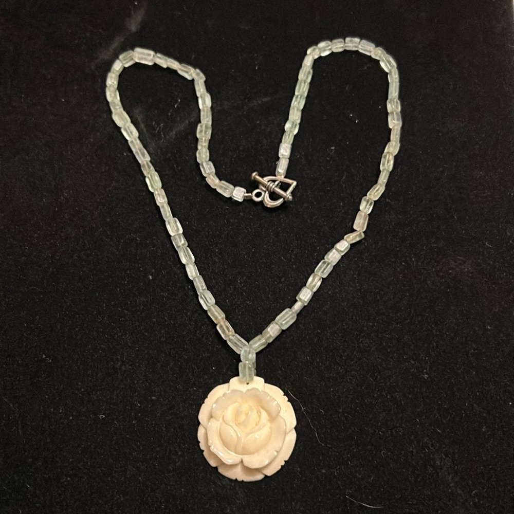 aqua necklace with ivory colored rose